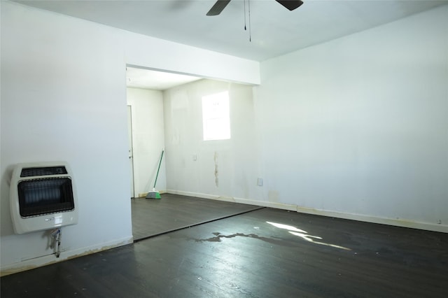 empty room with ceiling fan and heating unit