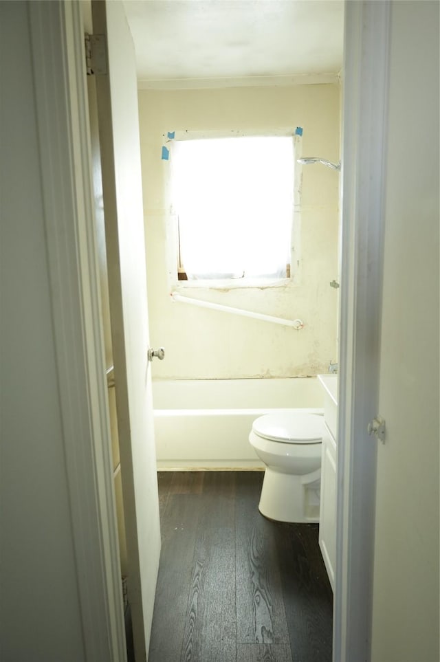 bathroom with wood-type flooring, toilet, and vanity