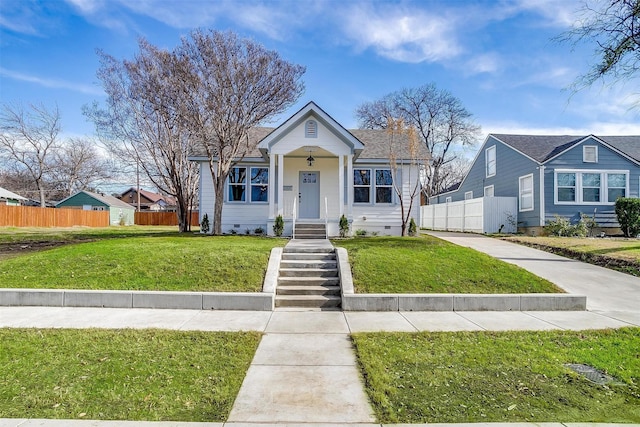 bungalow-style house featuring a front yard