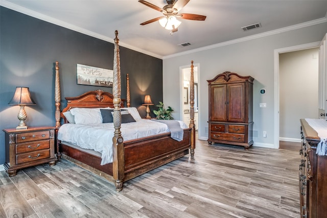 bedroom featuring ceiling fan, light hardwood / wood-style flooring, and crown molding