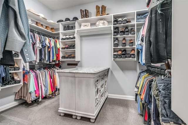 walk in closet with carpet flooring