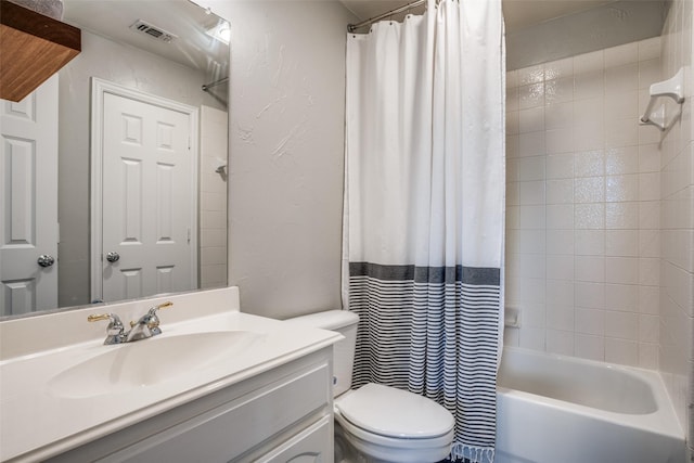 full bathroom featuring toilet, vanity, and shower / bath combo