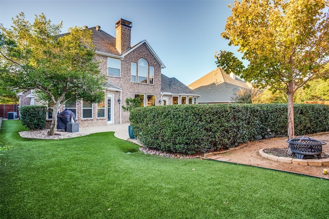 view of yard with an outdoor fire pit