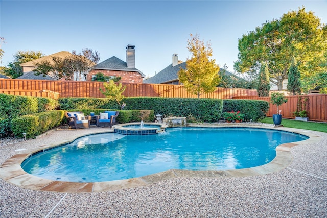 view of swimming pool with an in ground hot tub, a patio area, and an outdoor living space