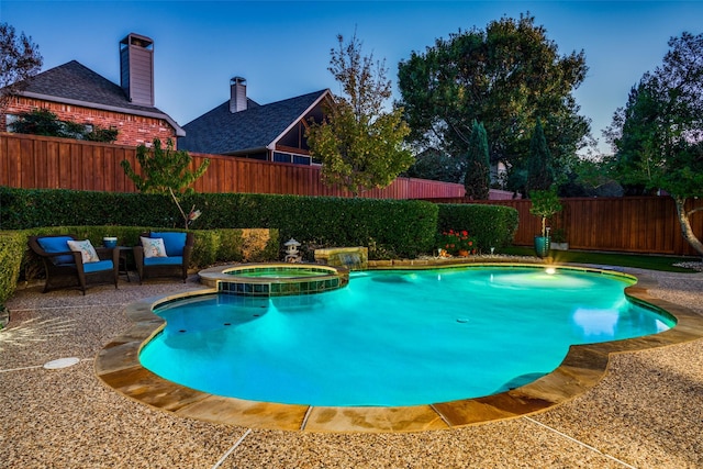 view of pool featuring an in ground hot tub and a patio area