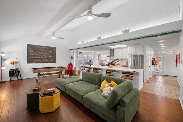 living room with ceiling fan, vaulted ceiling with beams, pool table, and hardwood / wood-style floors