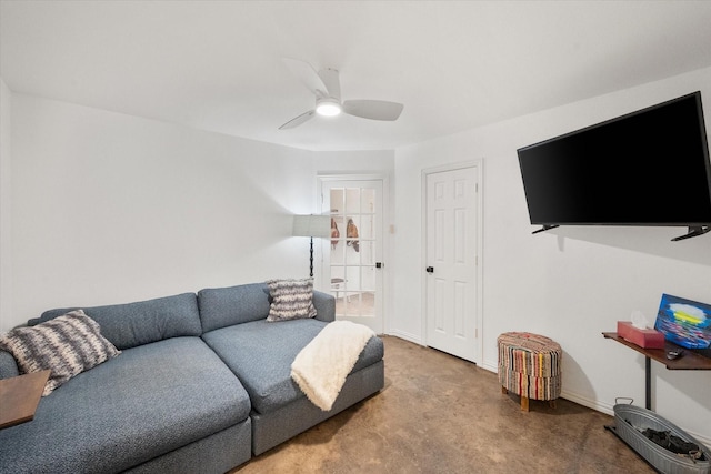 carpeted living room with ceiling fan