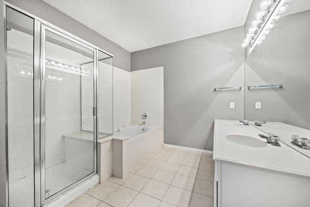 bathroom featuring vanity, independent shower and bath, tile patterned floors, and a textured ceiling