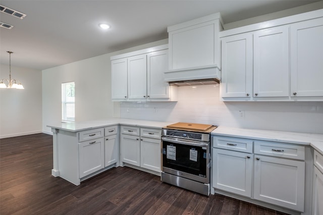 kitchen with white cabinets, electric range, and pendant lighting