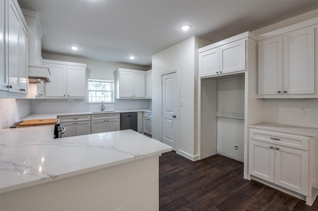 kitchen featuring stove, stainless steel dishwasher, white cabinets, and sink