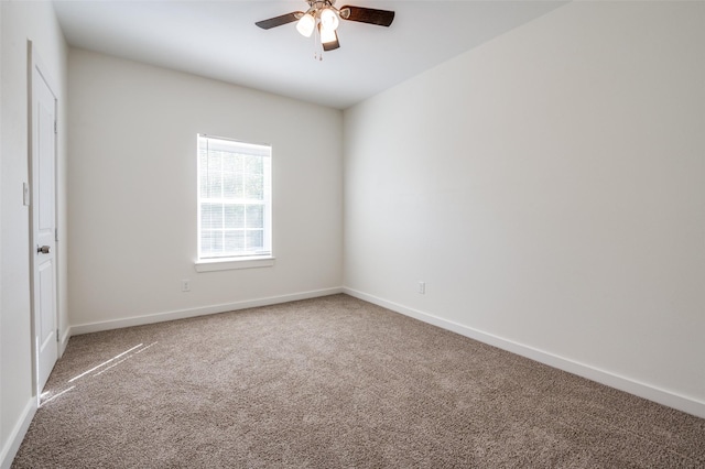 empty room featuring ceiling fan and carpet floors