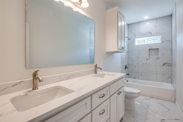 full bathroom featuring toilet, tiled shower / bath combo, and vanity