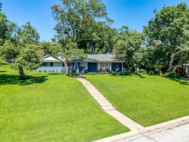 ranch-style home with a front lawn