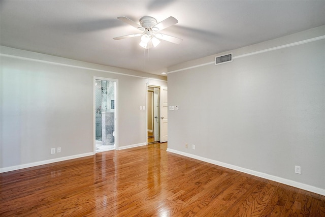 unfurnished room featuring ceiling fan and hardwood / wood-style floors