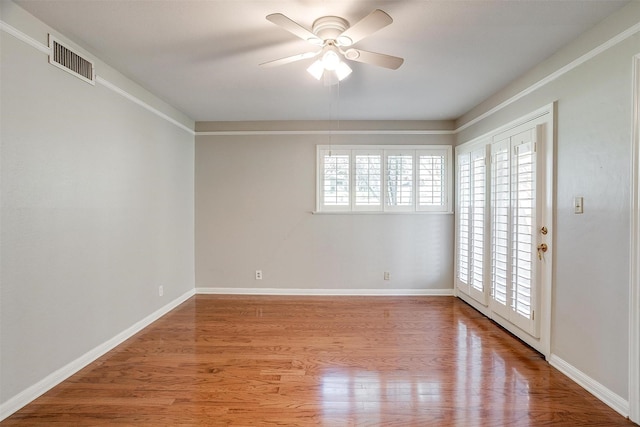 empty room with light hardwood / wood-style floors and ceiling fan