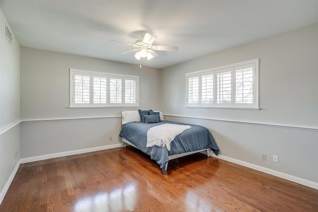 bedroom featuring ceiling fan and hardwood / wood-style floors