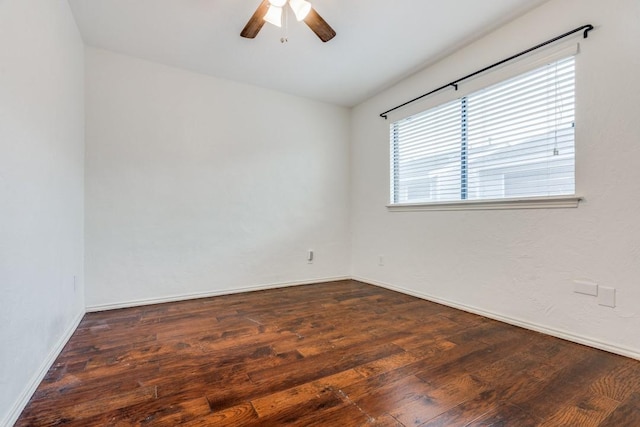 unfurnished room featuring ceiling fan and dark hardwood / wood-style flooring