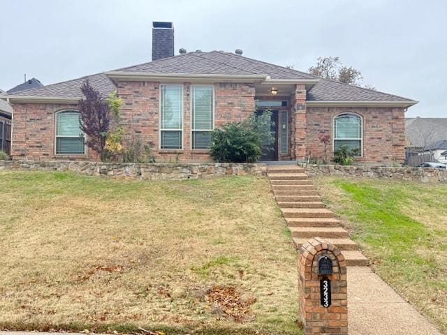 view of front of home with a front yard