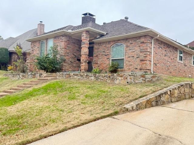 view of home's exterior with a yard