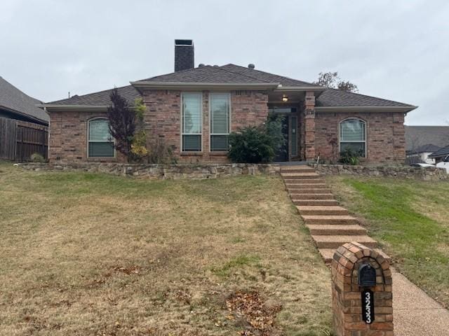 view of front of home with a front yard