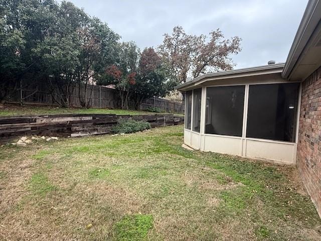 view of yard featuring a sunroom