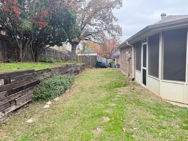 view of yard with a sunroom