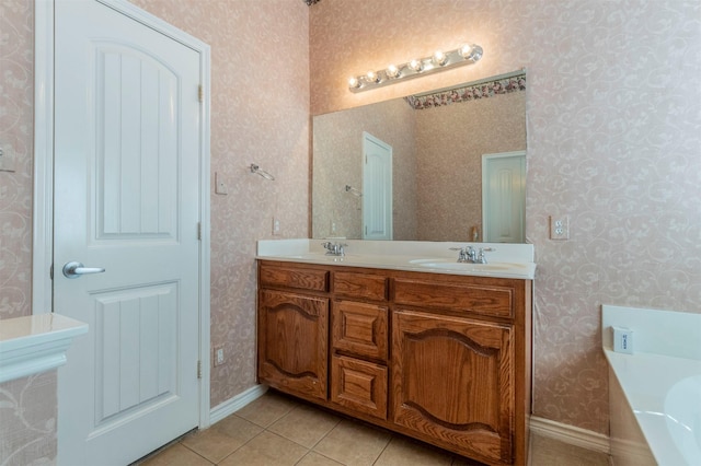 bathroom featuring tile patterned floors, vanity, and a bath