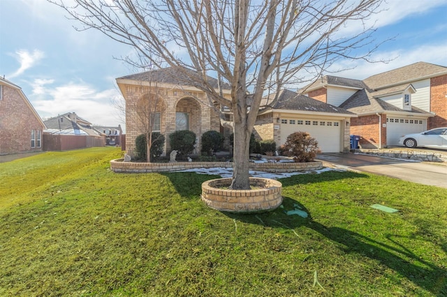 view of front of house with a garage and a front yard