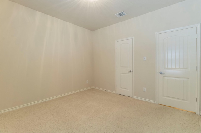 empty room with light colored carpet