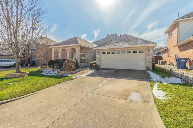 ranch-style home featuring a front lawn and central AC