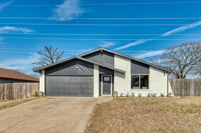 view of front facade with a garage and a front lawn