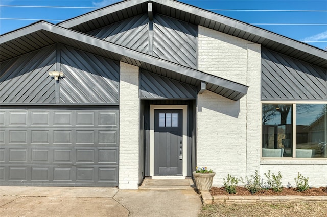 view of exterior entry with a garage