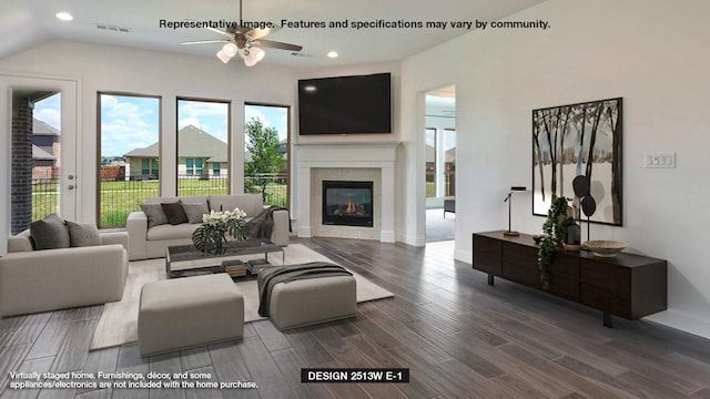 living room with ceiling fan and a fireplace