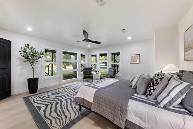 bedroom with ceiling fan and light hardwood / wood-style flooring