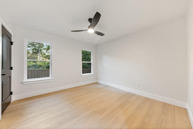 unfurnished room featuring light hardwood / wood-style floors and ceiling fan