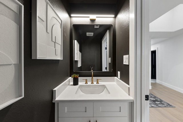 bathroom with wood-type flooring and vanity