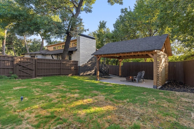 view of yard with a patio area, a gazebo, and a fire pit