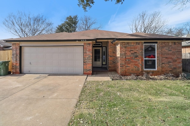 ranch-style house featuring a front lawn and a garage