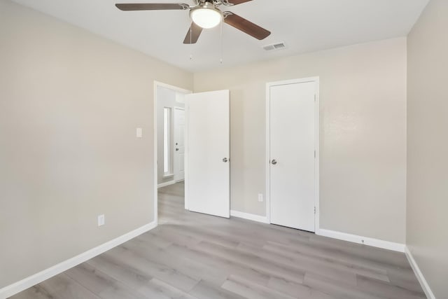 unfurnished bedroom featuring ceiling fan and light wood-type flooring