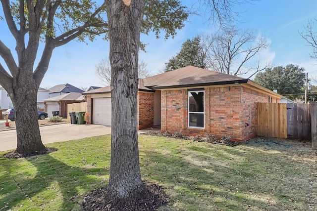 ranch-style house with a front yard and a garage