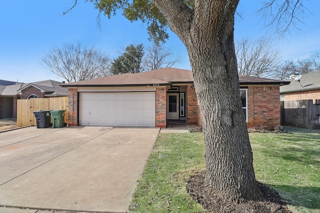 ranch-style house with a front lawn and a garage