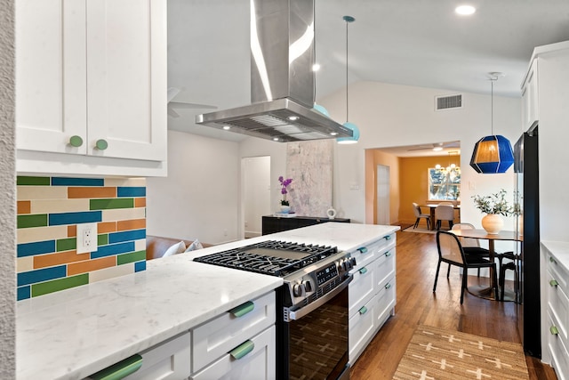 kitchen featuring white cabinetry, island range hood, hanging light fixtures, and stainless steel gas range oven