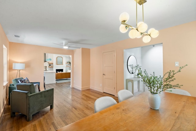 dining room featuring ceiling fan and wood-type flooring