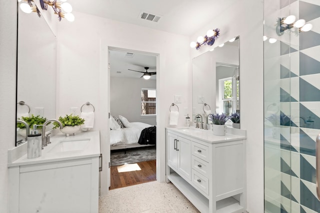 bathroom with ceiling fan and vanity