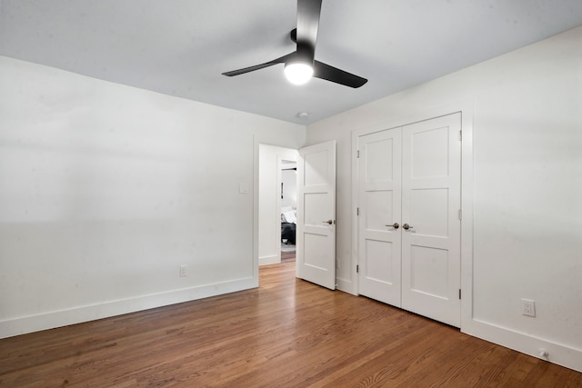 unfurnished bedroom with ceiling fan, light hardwood / wood-style flooring, and a closet