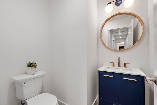 bathroom featuring toilet, vanity, and radiator heating unit