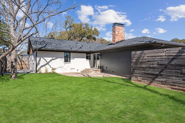 10414 Robindale Dr, Dallas, TX 75238 - rear view of house with a patio, fence, roof with shingles, a lawn, and a chimney