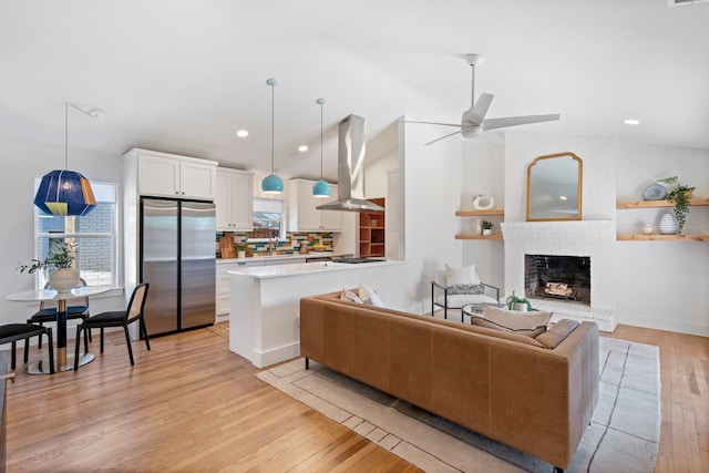 10414 Robindale Dr, Dallas, TX 75238 - living area featuring a ceiling fan, lofted ceiling, light wood-style floors, a fireplace, and recessed lighting