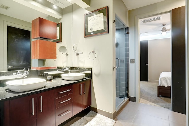 bathroom with ceiling fan, tile patterned floors, vanity, and a shower with shower door