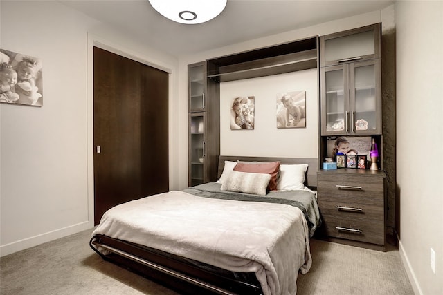 carpeted bedroom with a closet